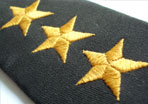 photo of military lapel with three gold stars